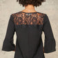 A Knit Top With Deep V Neckline And Yoke Design